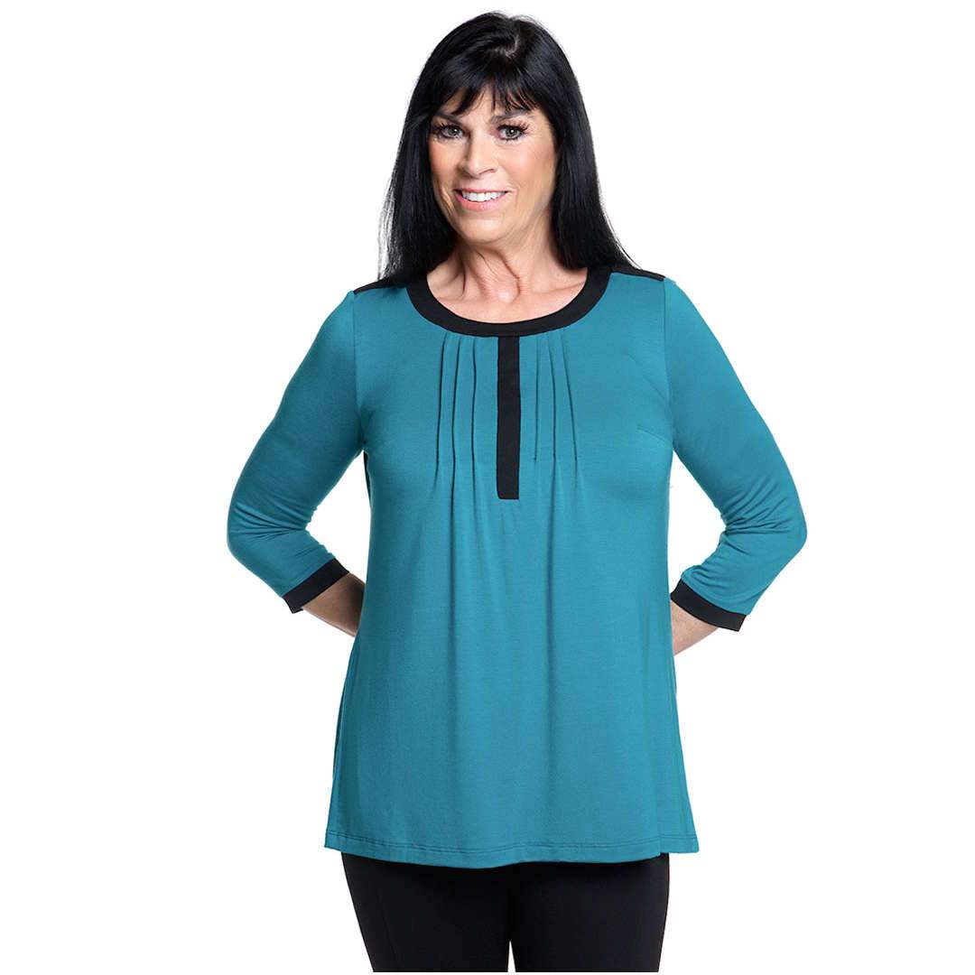 Teal women's top with black piping