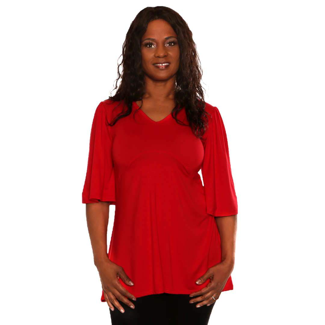 Red women's top with empire waist and asymmetrical hemline